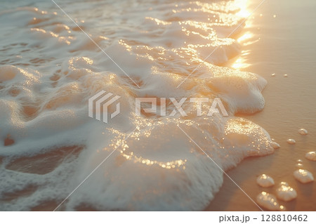 Ocean foam on the shore at sunset 128810462