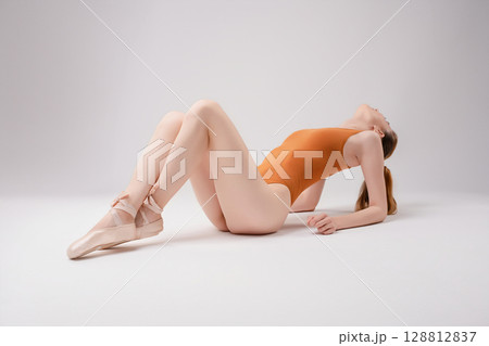 Stunning woman poses elegantly in a beauty studio with soft lighting Stunning woman poses elegantly in a beauty studio with soft lighting 128812837