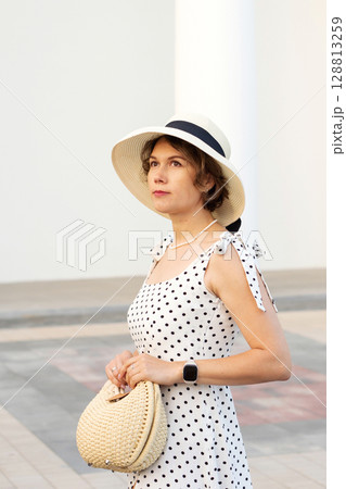 Profile of Woman in Straw Hat at Pavilion Profile of Woman in Straw Hat at Pavilion 128813259