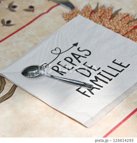 Paper towel with writing family meal on a table in summer 128814293