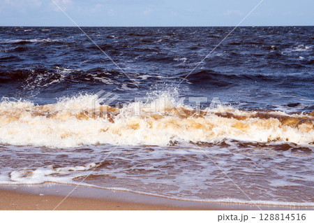 Strong Baltic Sea Waves Breaking on Shore on a Windy Summer Day Strong Baltic Sea Waves Breaking on Shore on a Windy Summer Day 128814516