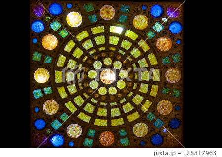 Colorful stained glass mosaic with circular patterns Colorful stained glass mosaic with circular patterns 128817963