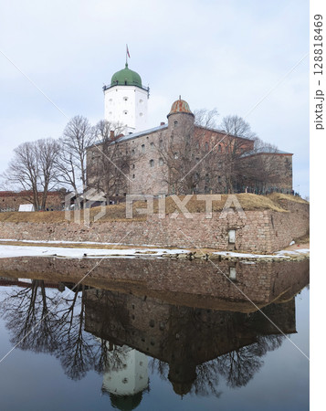 View of a medieval Swedish castle on an island, Vyborg. A photograph of a fortress and a castle reflected in the water, on a spring day. 2024. View of a medieval Swedish castle on an island, Vyborg. A photograph of a fortress and a castle reflected in the water, on a spring day. 2024. 128818469