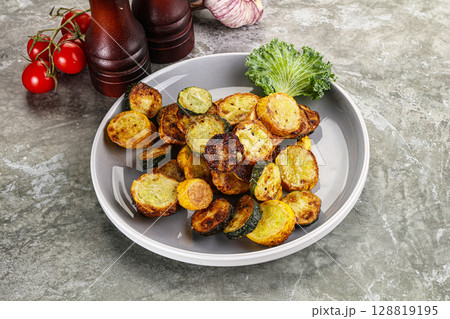 Roasted young zucchini in the plate Roasted young zucchini in the plate 128819195