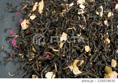 Loose Black Tea with Ginseng and Rose Petals Macro Top View Loose Black Tea with Ginseng and Rose Petals Macro Top View 128819630