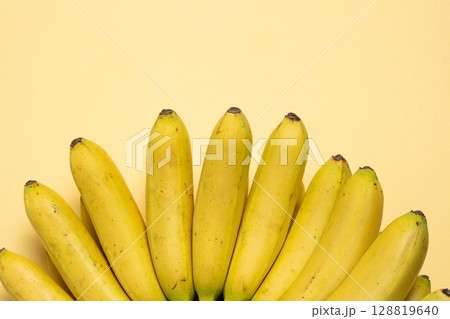 Bunch of mini baby bananas, copy space for text 128819640