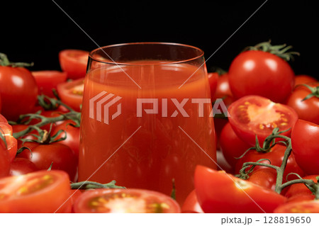 Refreshing Glass of Tomato Juice with Organic Tomatoes. 128819650