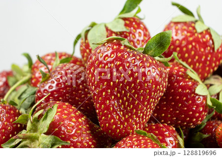 Ripe strawberries background. Sweet seasonal fruit concept. Ripe strawberries background. Sweet seasonal fruit concept. 128819696