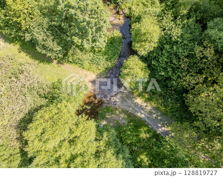 Thommen, Liege, Belgium, Aerial View of a Beautiful Serene Stream Surrounded by the Lush Green 128819727