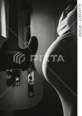 Pregnant Woman with Guitar in Black and White 128819779