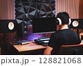 back of asian professional male music producer, arranger, composer working in home studio. music production concept 128821068