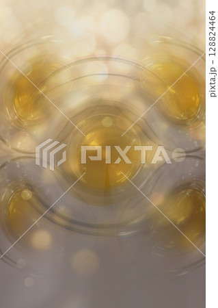 Abstract Turkish Tea Reflection with Golden Bokeh 128824464