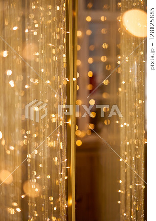 Golden Bokeh Background with Shimmering Threads 128825885