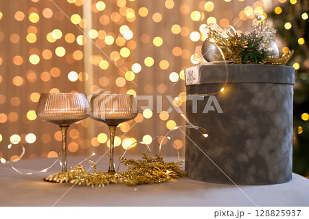 Sparkling Champagne Glasses with Bokeh Lights 128825937