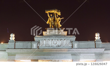 Sculpture Tractor operator and collective farmer on the top of entrance to All-Russia Exhibition Centre timelapse hyperlapse. 128826047