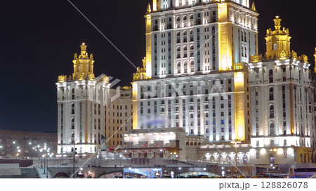Hotel Ukraine winter night timelapse hyperlapse with bridge over Moscow River. Hotel Ukraine winter night timelapse hyperlapse with bridge over Moscow River. 128826078