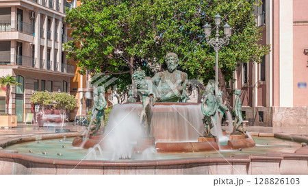 Timelapse of Plaza de la Virgen with the iconic Turia Fountain in Valencia, Spain. Timelapse of Plaza de la Virgen with the iconic Turia Fountain in Valencia, Spain. 128826103