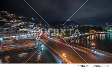 Colorful traditional houses panorama with wooden carved balconies in the Old Town of Tbilisi aerial timelapse, Georgia. 128826206