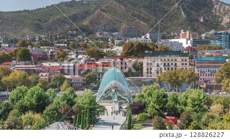 Timelapse of the Bridge of Peace, a bow-shaped pedestrian bridge in Tbilisi, Georgia 128826227