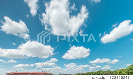 Beautiful blue sky timelapse with soft white clouds moving forward. Beautiful blue sky timelapse with soft white clouds moving forward. 128826241