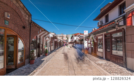 Walk on street in Bascarsija, an oriental bazaar and an old Ottoman historic center of Sarajevo timelapse hyperlapse, Bosnia and Herzegovina 128826324