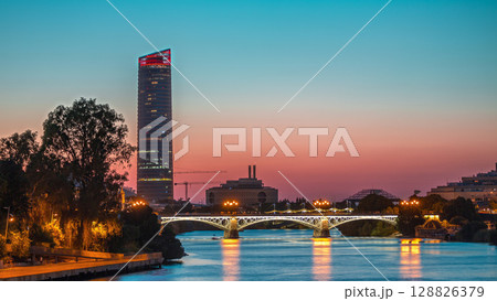 Seville skyline day to night timelapse with Torre Sevilla and Triana Bridge Seville skyline day to night timelapse with Torre Sevilla and Triana Bridge 128826379