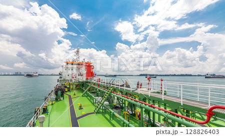 Green deck of the tanker under blue sky timelapse 128826403