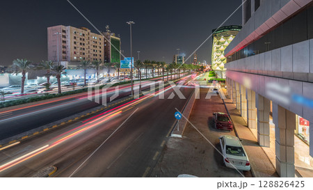 Aerial night timelapse of King Fahd Road near the illuminated Riyadh National Library in Riyadh, Saudi Arabia. 128826425