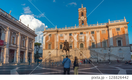 Capitoline hill landmark square timelapse hyperlapse surrounded by neo classic museums buildings with clock tower and bronze statue of Mark Aurelius Capitoline hill landmark square timelapse hyperlapse surrounded by neo classic museums buildings with clock tower and bronze statue of Mark Aurelius 128826442