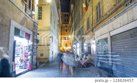Walk down streets of Rome timelapse hyperlapse from the Pantheon to fountain Trevi showing restaurants and the blur of people at night 128826457