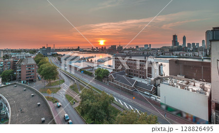 Aerial panoramic view over Maashaven timelapse at sunset in Rotterdam. 128826495