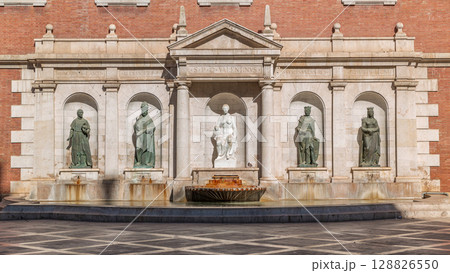 Patriarch's College Square in Valencia timelapse, featuring fountain with sculptures. Spain 128826550