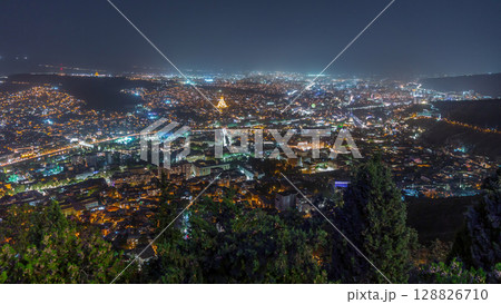Tbilisi cityscape, Georgia day to night aerial timelapse. Top view over the city center and Kura river in Tbilisi. 128826710