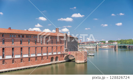 Aerial hyperlapse of Toulouse's historic Hotel Dieu Saint-Jacques by the Garonne River, France. 128826724