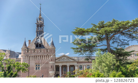 Renaissance dungeon clock tower and classical brick facade of the Capitole timelapse hyperlapse, city hall of Toulouse, France 128826725