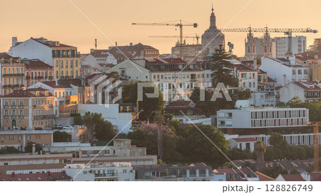 Aerial view over the center of Lisbon to the viewpoint called Miradouro de Sao Pedro de Alcantara timelapse. 128826749
