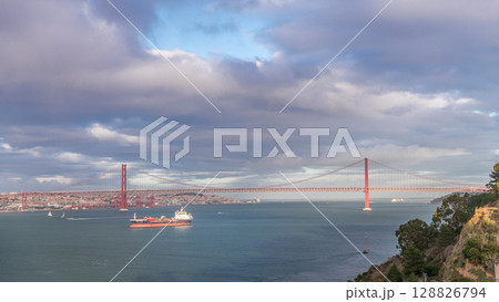 Aerial timelapse of the 25th April Bridge, suspension bridge in Lisbon, Portugal Aerial timelapse of the 25th April Bridge, suspension bridge in Lisbon, Portugal 128826794