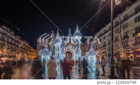 Night timelapse hyperlapse of Christmas decorations with illuminated castle on Luis de Camoes square in Lisbon, Portugal. Night timelapse hyperlapse of Christmas decorations with illuminated castle on Luis de Camoes square in Lisbon, Portugal. 128826796