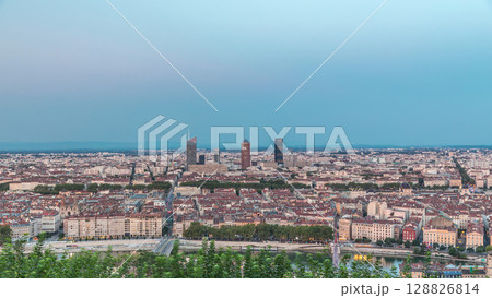 Panoramic aerial view of Lyon after sunset from Fourviere Hill day to night transition. France 128826814