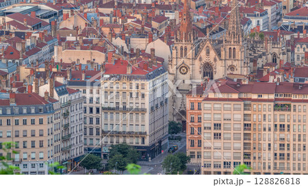 Aerial timelapse of the Church of Saint-Nizier in the Presqu'ile district of Lyon, France. 128826818