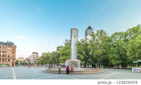 Opera Square timelapse hyperlapse in downtown Frankfurt, Germany, showcases a fountain with skyscrapers Opera Square timelapse hyperlapse in downtown Frankfurt, Germany, showcases a fountain with skyscrapers 128826859