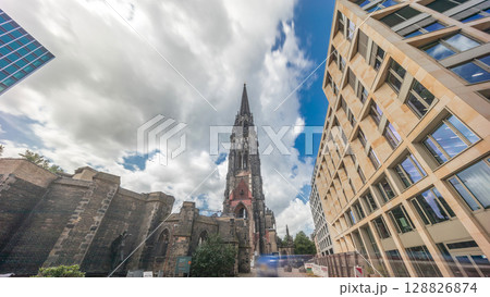 Looking up perspective to the facade of Ehemalige Hauptkirche St. Nikolai timelapse hyperlapse in Hamburg, Germany 128826874