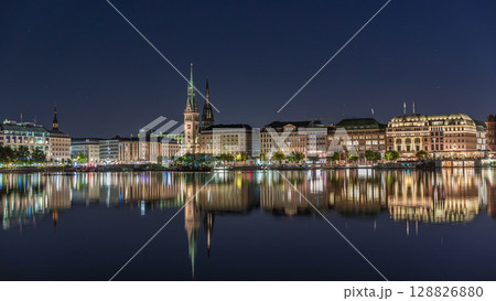 Night timelapse of Binnenalster in Hamburg, Germany, with City Hall and Nikolai Church. 128826880