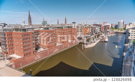 Aerial timelapse of modern Hamburg, Germany, showcasing red brick facades of residential and office buildings. Aerial timelapse of modern Hamburg, Germany, showcasing red brick facades of residential and office buildings. 128826898