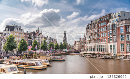 Panoramic timelapse hyperlapse of Amsterdam city center featuring Amstel River, waterfront and Munttoren tower. Netherlands 128826963
