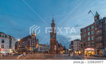 Munttoren tower and flowers market. Panoramic day to night timelapse hyperlapse of Amsterdam city center. Netherlands Munttoren tower and flowers market. Panoramic day to night timelapse hyperlapse of Amsterdam city center. Netherlands 128826977