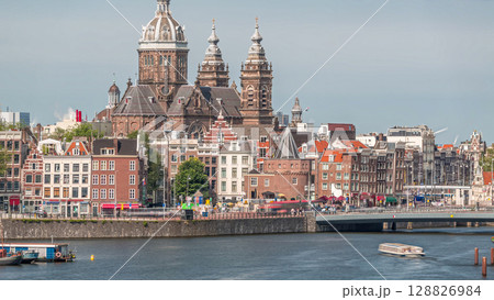 Aerial cityscape with the Basilica of Saint Nicholas in Amsterdam's Old Centre near the Central Station timelapse. Aerial cityscape with the Basilica of Saint Nicholas in Amsterdam's Old Centre near the Central Station timelapse. 128826984
