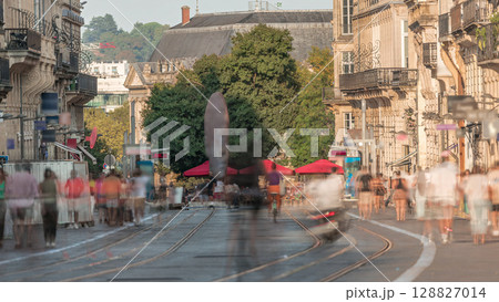 L'Intendance Street in Bordeaux timelapse during sunset with modern trams 128827014