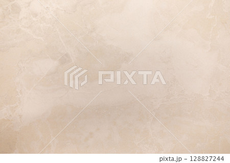 Abstract marble texture with subtle patterns in a light beige hue creating a serene backdrop for Abstract marble texture with subtle patterns in a light beige hue creating a serene backdrop for 128827244