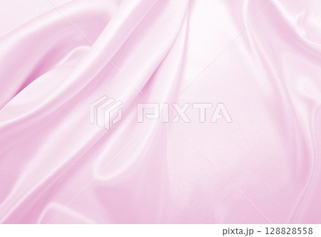 Smooth elegant pink silk or satin texture as wedding background. Luxurious background design 128828558